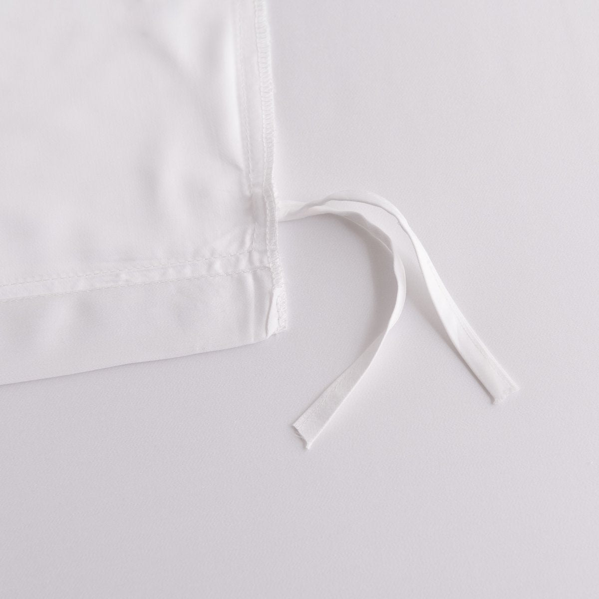 Close-up of a tie/closure detail on the Coco White bamboo bedding
