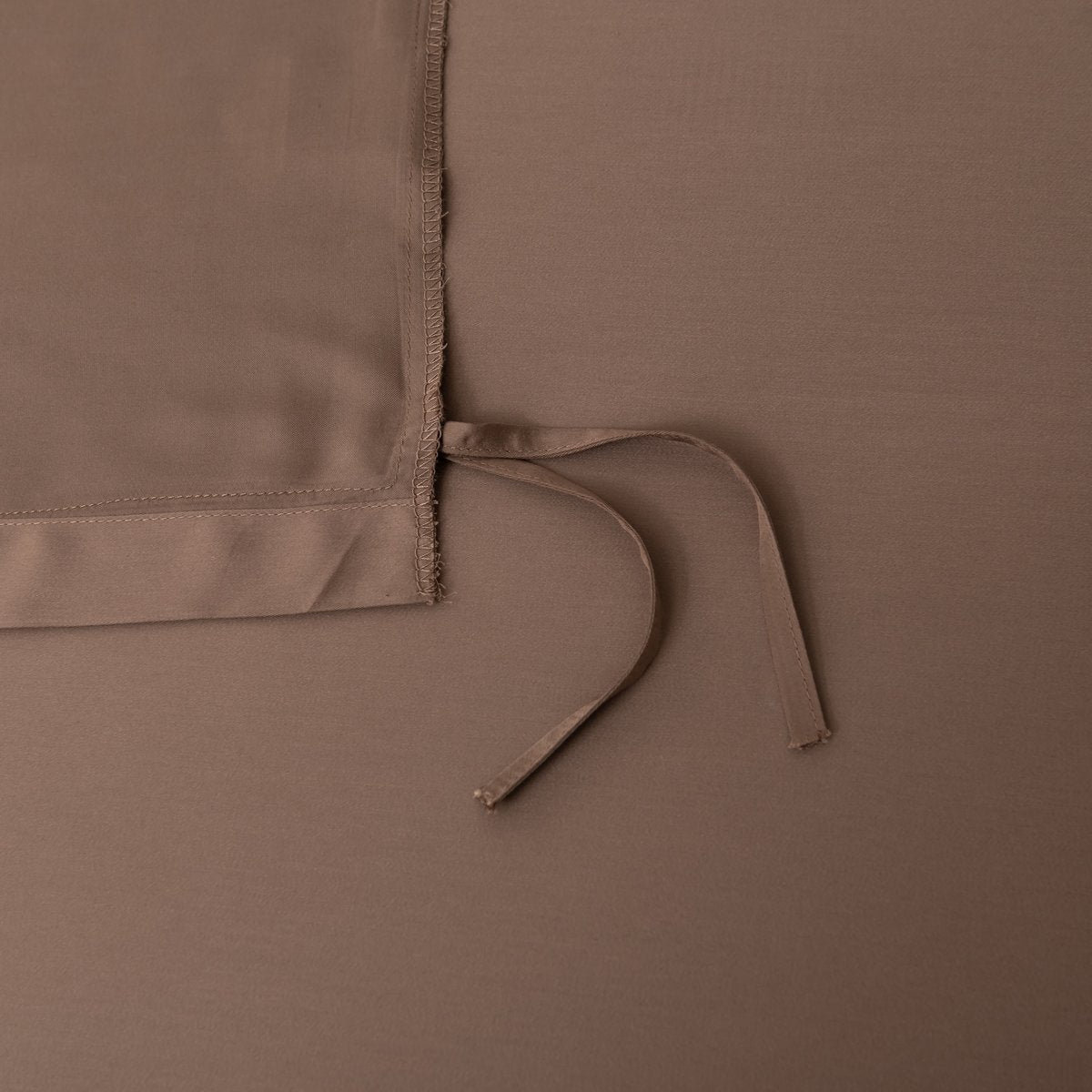 Close-up of a tie/closure detail on the Coffee Brown bamboo bedding