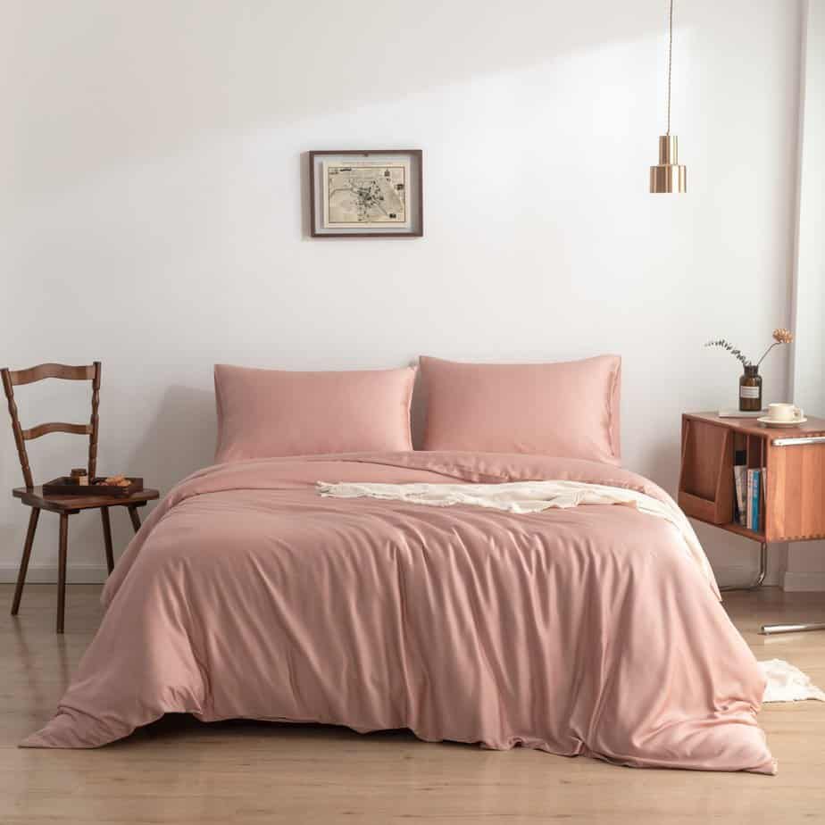 Cuddle Pink bamboo bedding set on a made bed