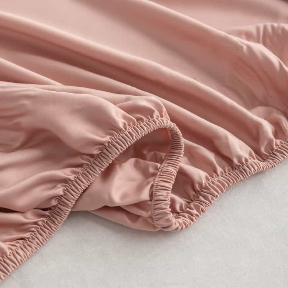Folded Cuddle Pink bamboo fabric showing its natural sheen