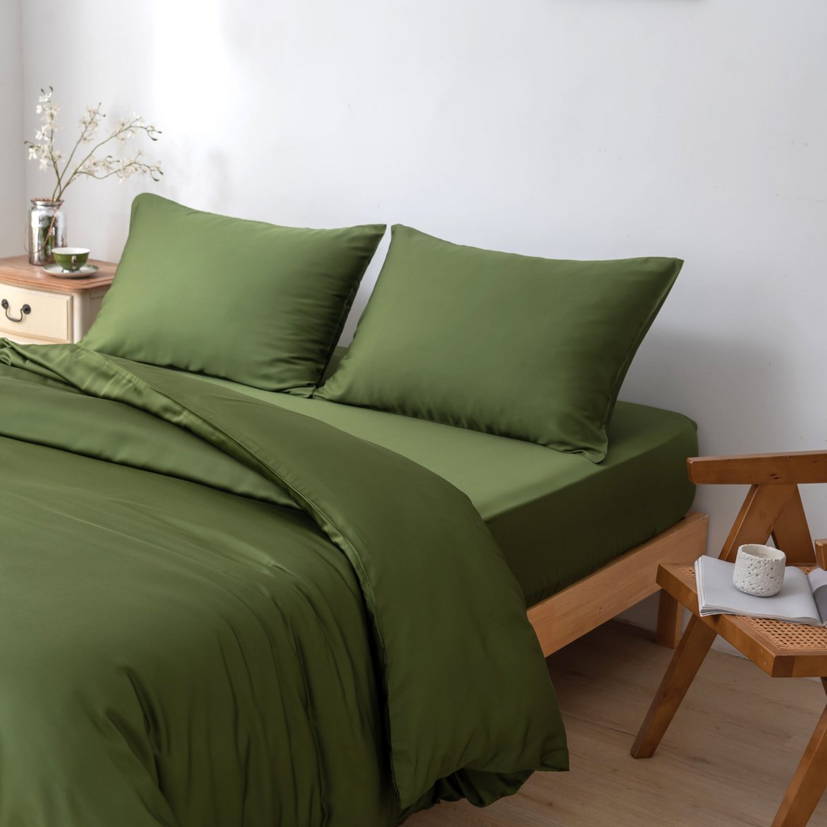 Deep Moss bamboo bedding set on a wood-framed bed
