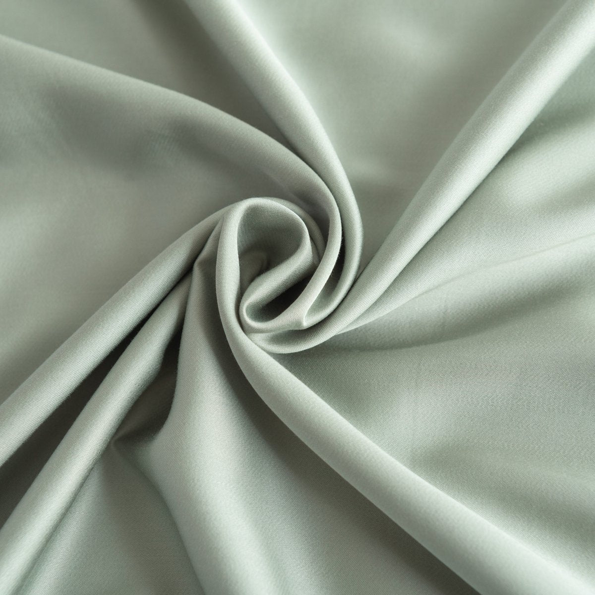 Draped Sage Green bamboo fabric showing its soft, silky texture