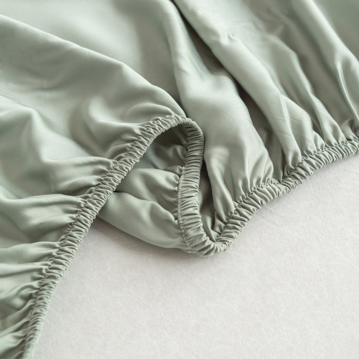 Close-up of the soft, silky weave of the Sage Green bamboo fabric