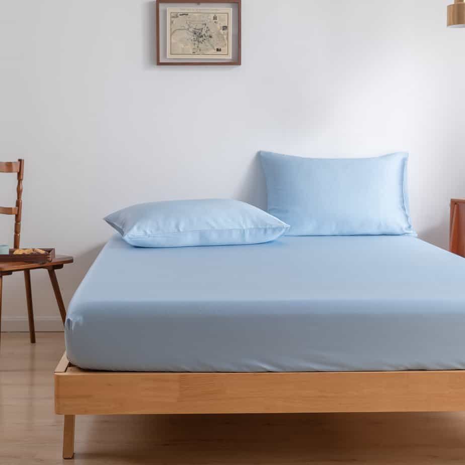 Sky Blue bamboo bedding set on a fully made bed