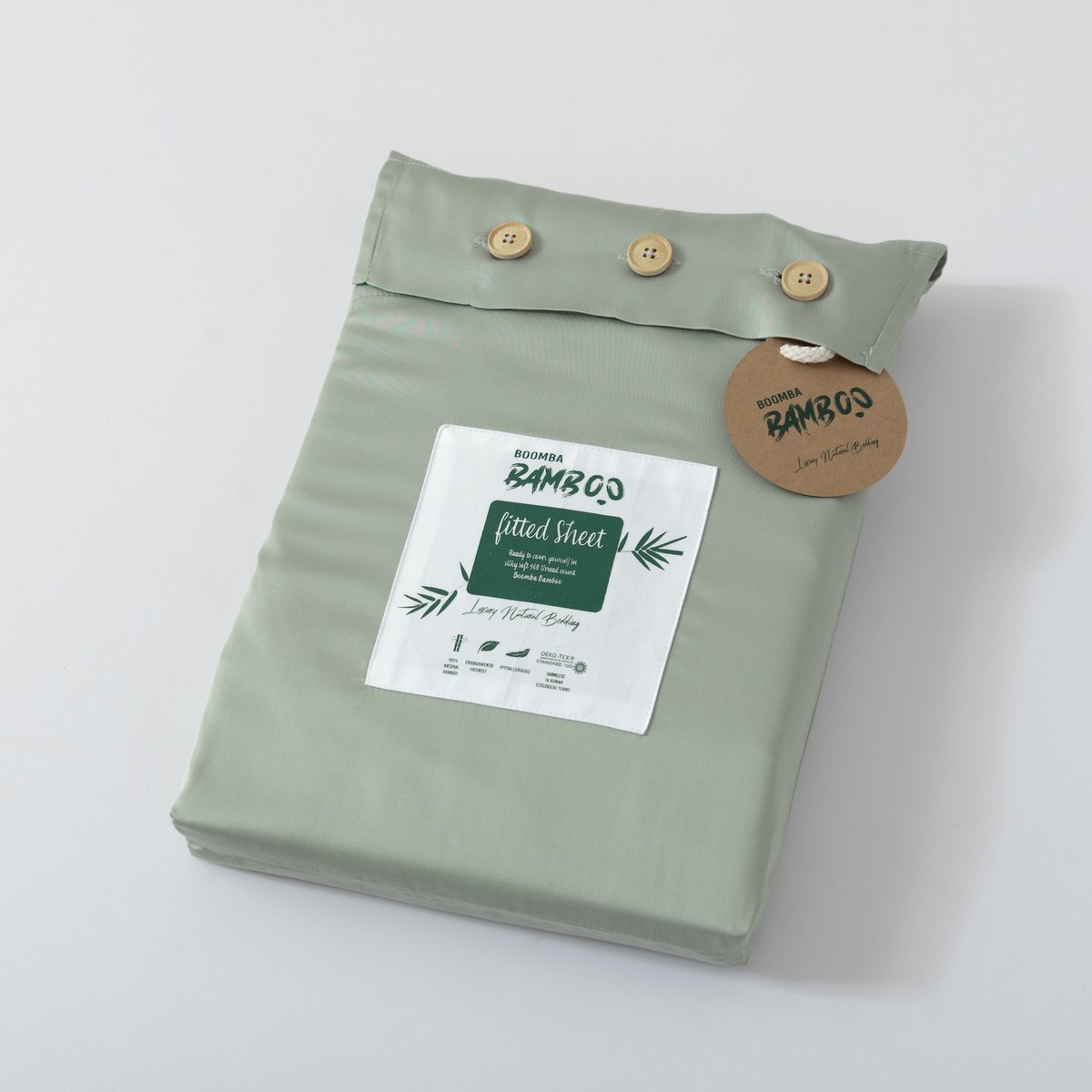 Sage Green bamboo fitted sheet for mattress toppers folded and packaged with the Boomba Bamboo product label.