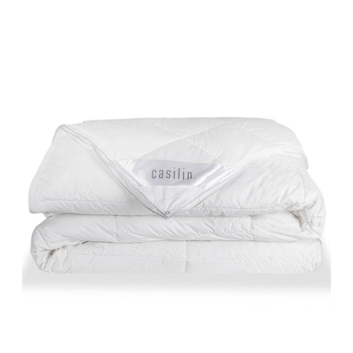 Folded white Casilin Prince Duo down duvet with the Casilin brand label and press-stud corner visible