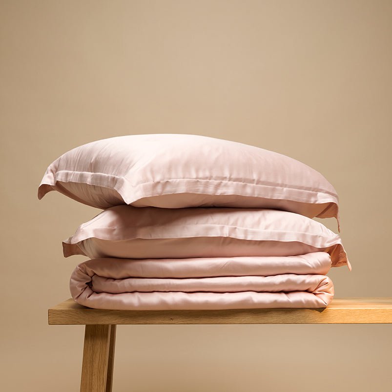 Eco Bamboo Duvet Cover and pillows in Powder Peach, folded
