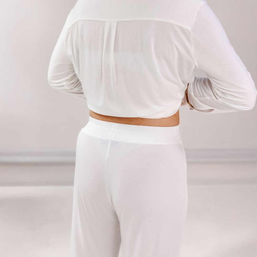 Close-up of the back of the Off White pyjama shirt and the elastic waistband of the trousers