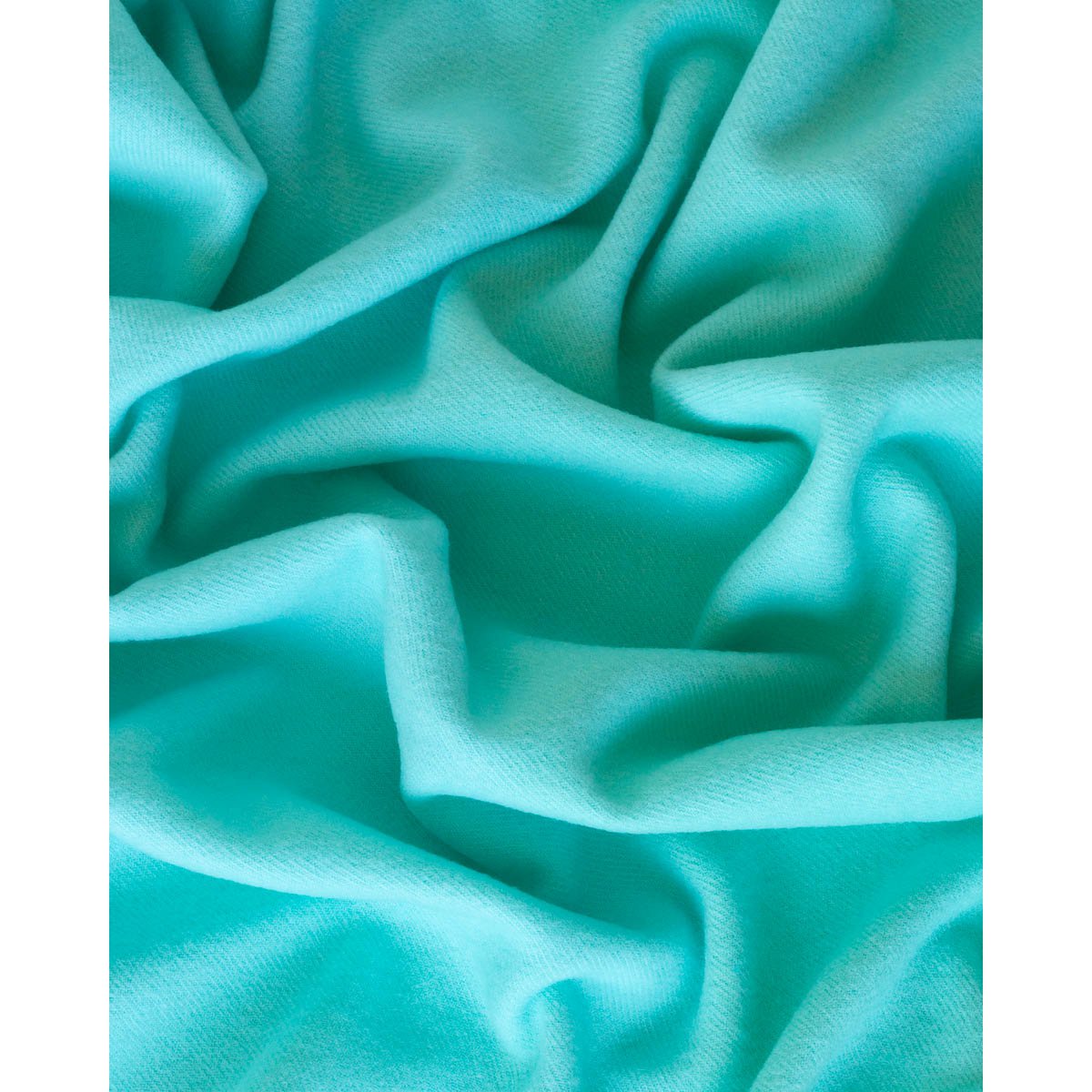 Close-up of Rio throw's woven green wool texture