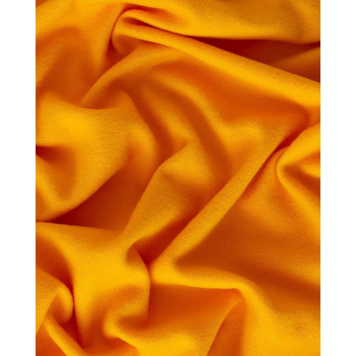 Close-up of the Rio throw's soft yellow wool