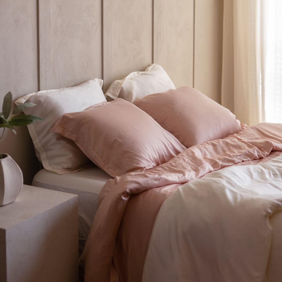 Two single duvets side by side on a double bed as an alternative to one large duvet