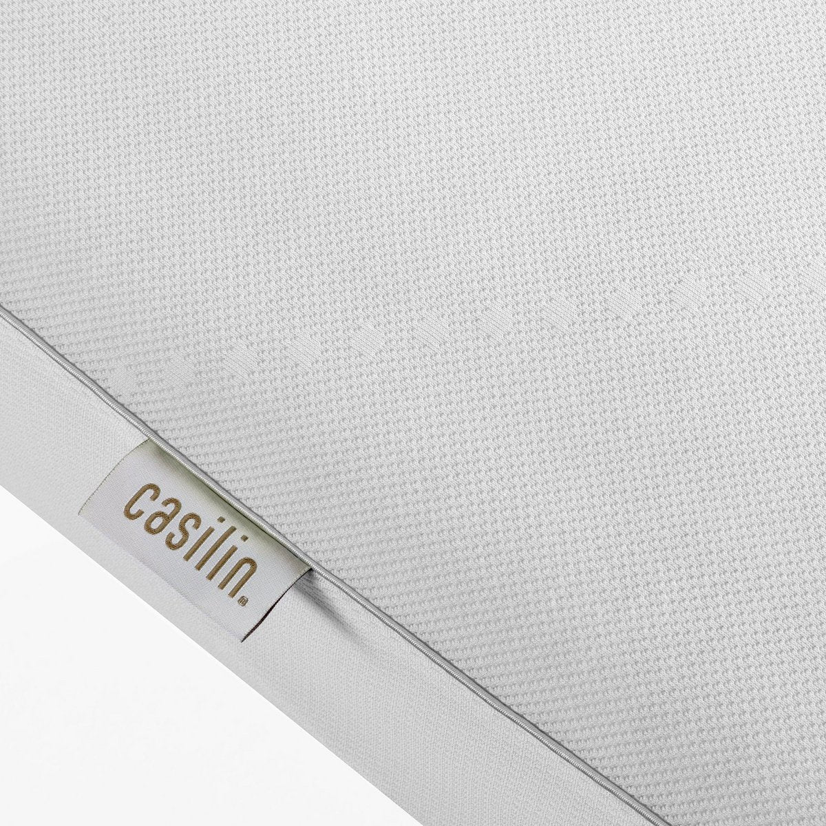Close-up of the Air Cover waterproof mattress protector fabric and label