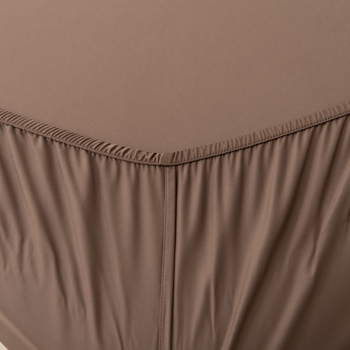 Coffee Brown bamboo fitted sheet showing its soft, gathered elastic edge