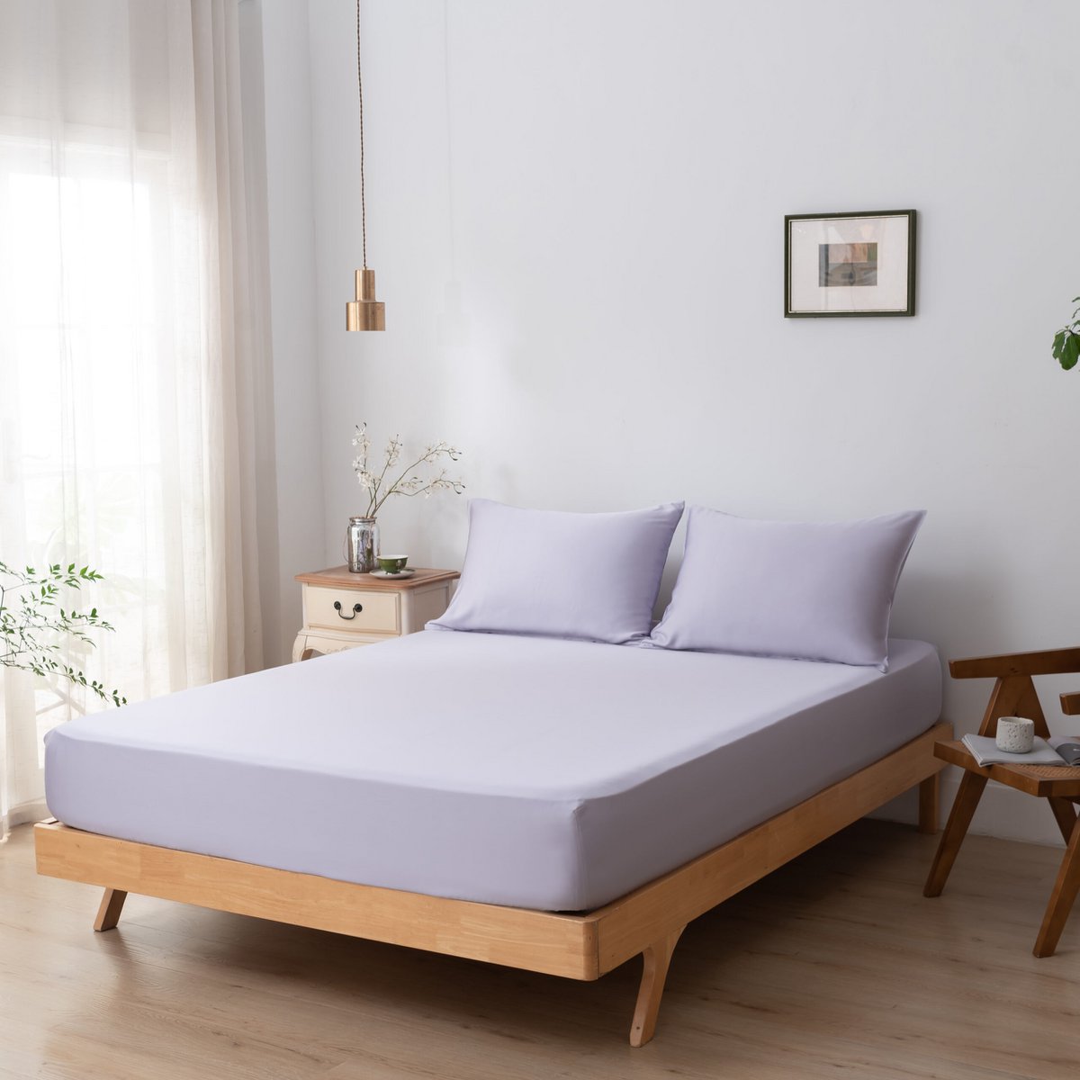 Lavender Mist bamboo bedding set styled on a bed by a window