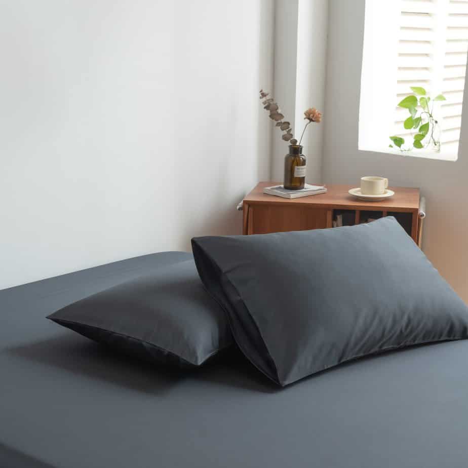 Space Blue bamboo pillowcase styled by a window