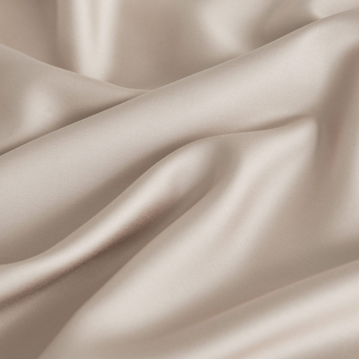 Close-up of draped Soft Taupe bamboo fabric highlighting its soft sheen.