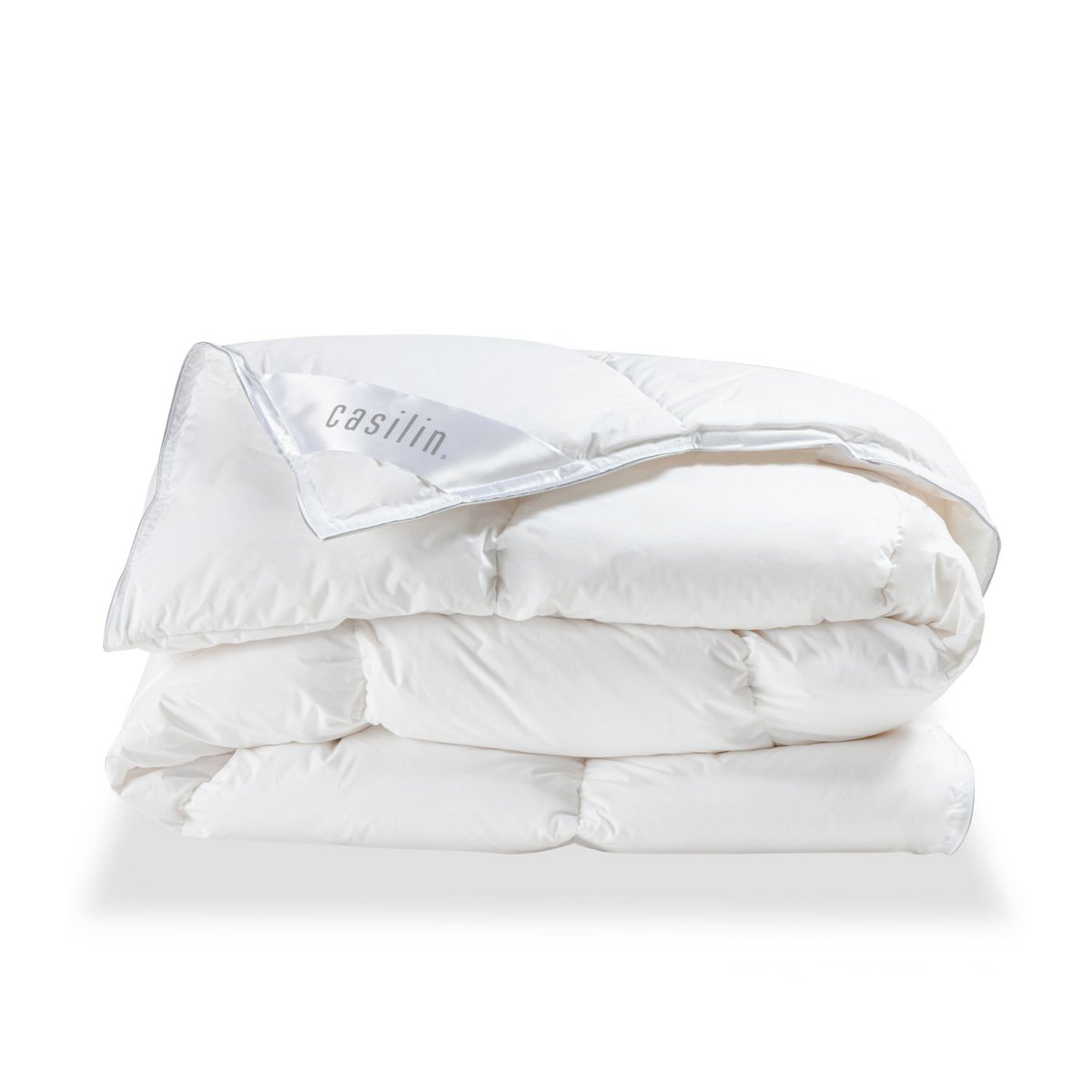 Folded white Casilin Duvet Crown goose down duvet with the Casilin brand label visible on the corner