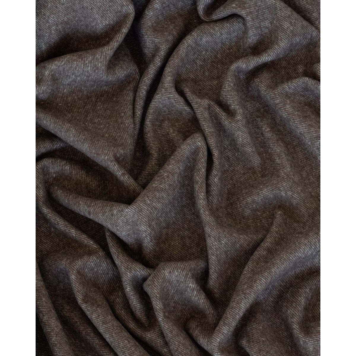 Close-up of Tibet throw's soft cashmere-wool texture in brown