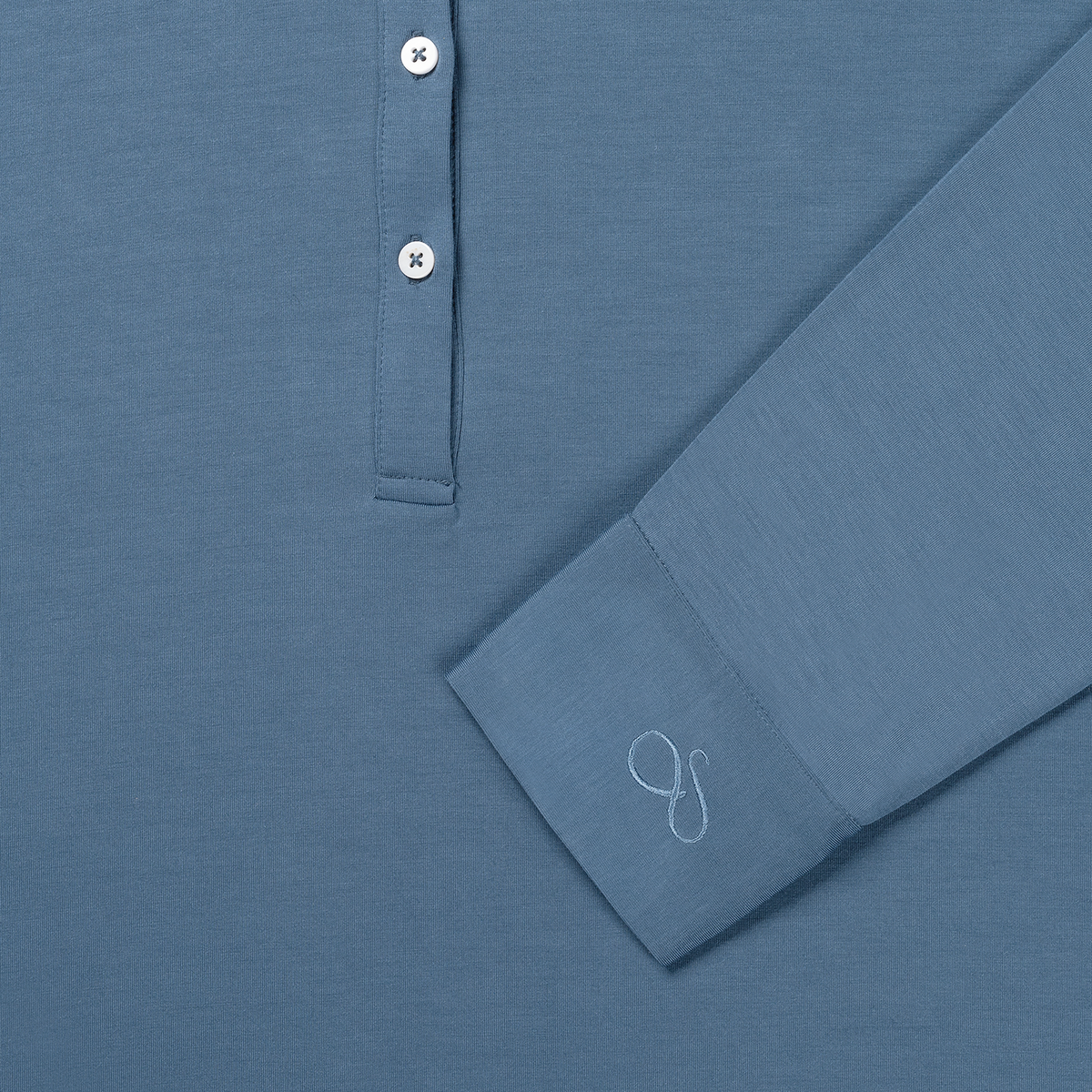 Close-up of the buttons and the embroidered cuff of the Dark Blue nightgown