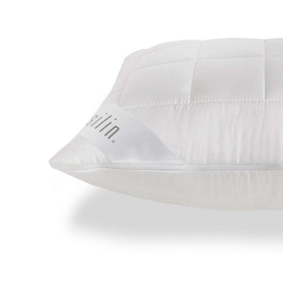 Close-up of the quilted white Tencel satin cover and zipper closure on a Casilin pillow