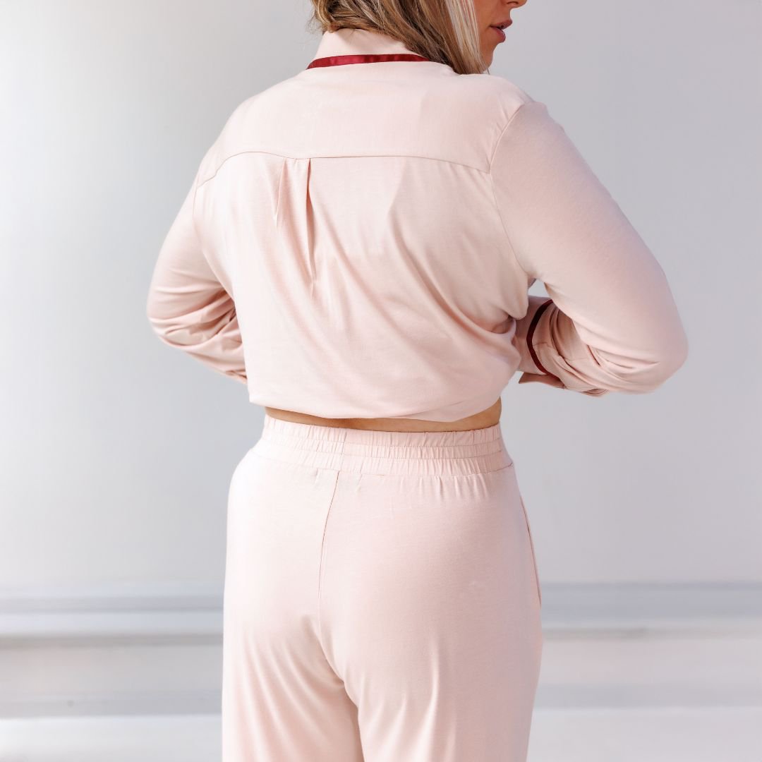 Close-up of the back of the Powder Peach pyjama shirt and the elastic waistband of the trousers