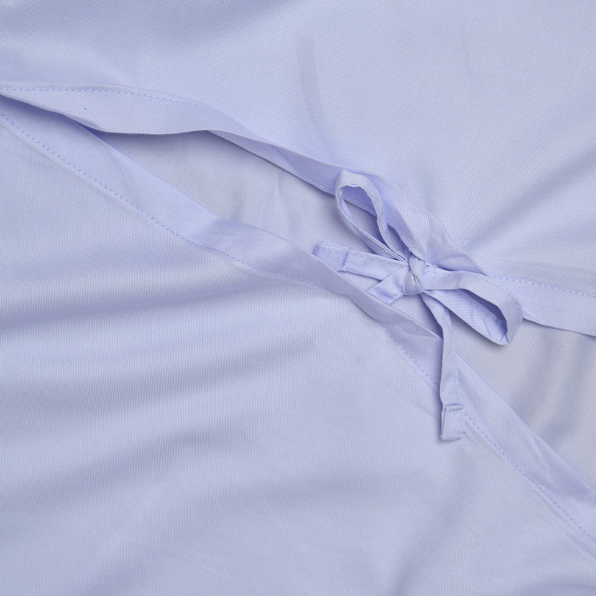 Close-up of a tied detail on the Tencel™ Twill Duvet Cover in Lavender Blue