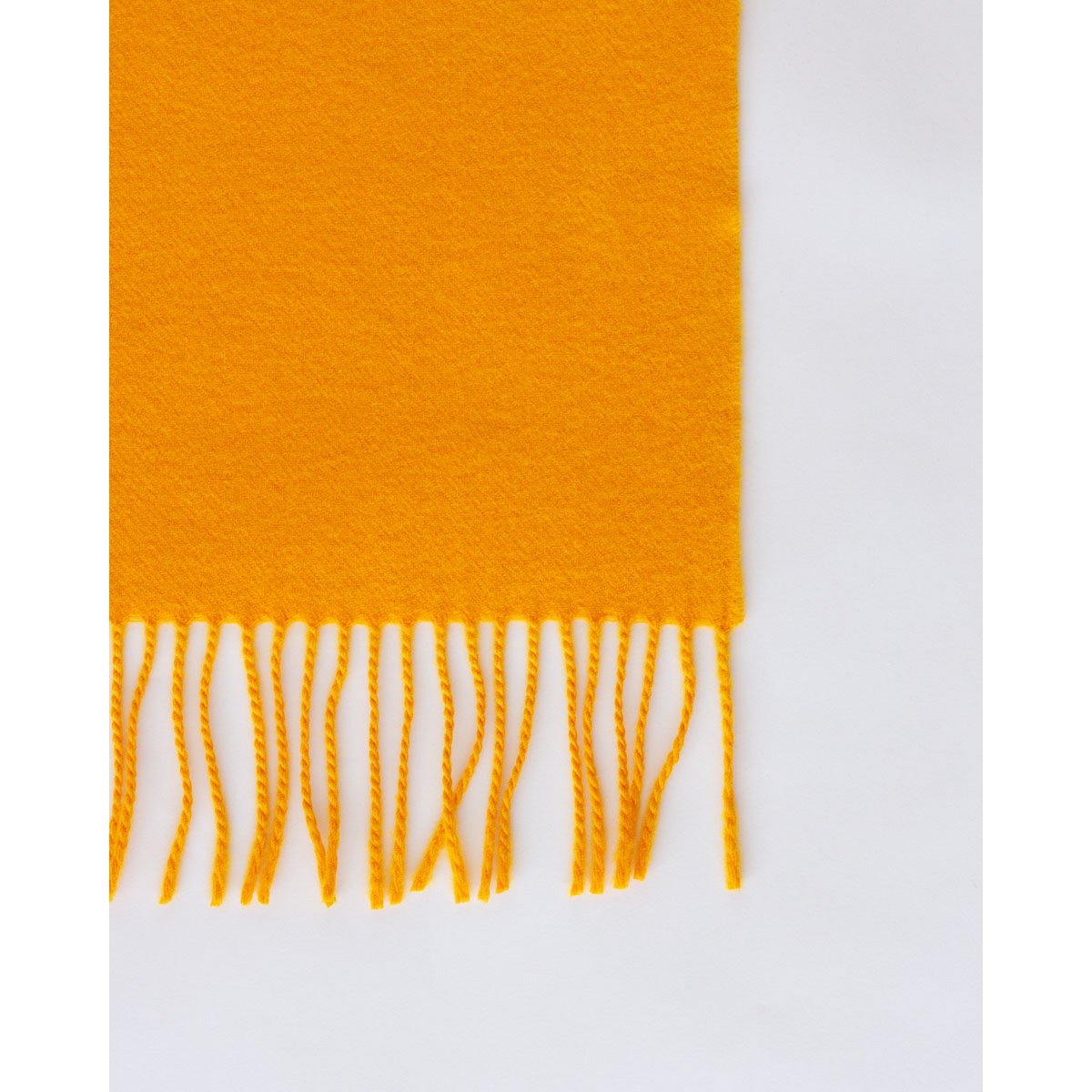 Fringed end of the Rio throw in yellow